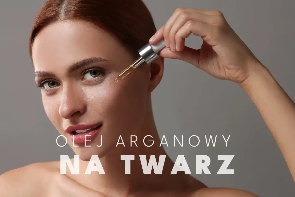 Kobieta aplikuje kroplę olejku arganowego na twarz. Luksusowa pielęgnacja dla Twojej sk&oacute;ry.